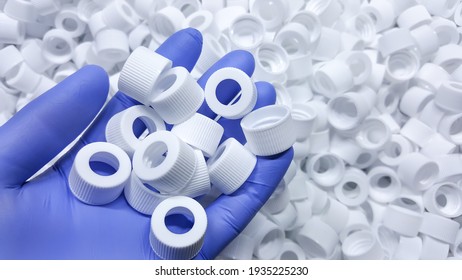 White Medical Plastic Bottle Caps. Made From Injection Molding Machine, Of The Manufacturing And Assembly Department, In The Plastics Industry