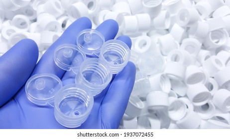 White Medical Plastic Bottle Caps. Made From Injection Molding Machine, Of The Manufacturing And Assembly Department, In The Plastics Industry