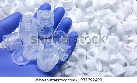 White Medical plastic bottle caps. Made from injection molding machine, of the manufacturing and assembly department, In the plastics industry