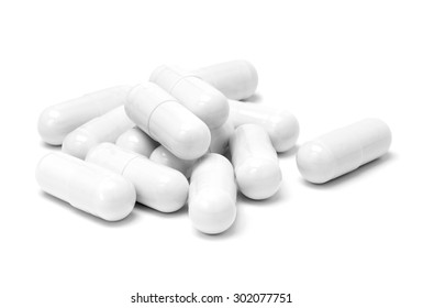 White medicine capsules isolated on white background