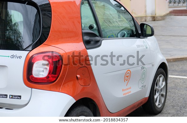 White Mercedes Benz Smart car with logo -\
You Drive - Russian carsharing company in MOSCOW - May, 2021. This\
is system of short-term car rental, economy and collaborative\
consumption,\
self-driving.