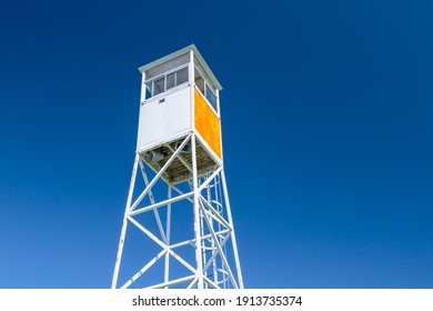 white metallic watchtower on blue sky