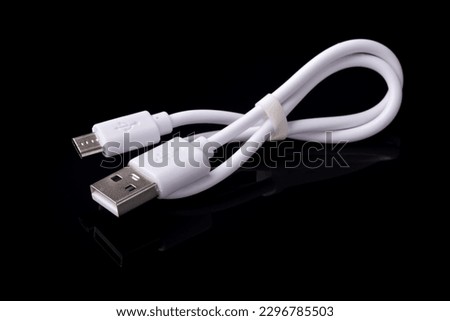 White micro usb to usb cable isolated on black