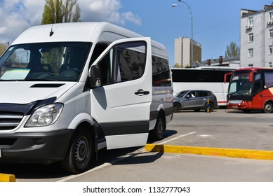 white microbus on bus station - Powered by Shutterstock