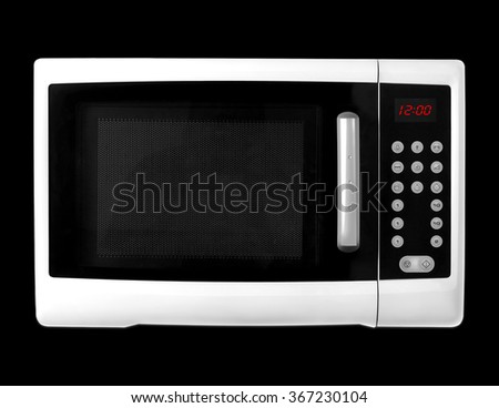 White microwave on a black background. It is isolated, the worker of paths is present.
