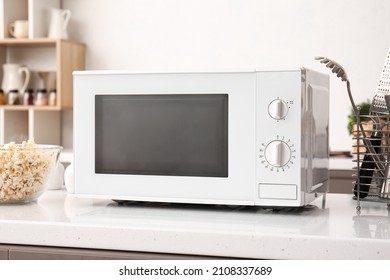 White Microwave Oven On Counter In Kitchen