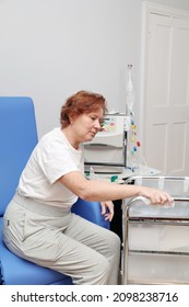 White Middle Age Woman Patient With Kidney Failure Preparing For Home Hematological Dialysis, Disinfecting Trolley