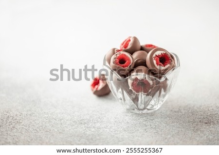 White and milk chocolate glazed raspberry candy