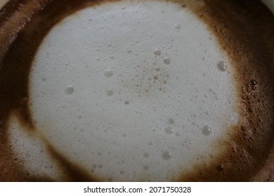 White Milk Froth In Hot Coffee Cup