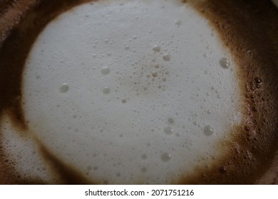 White Milk Froth In Hot Coffee Cup