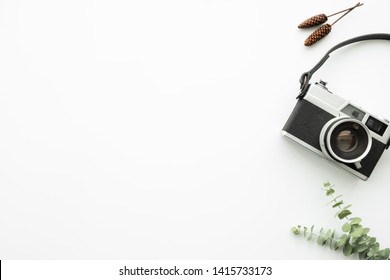 White minimal hipster photographer office desk table with retro film camera. Top view with copy space, flat lay. - Powered by Shutterstock