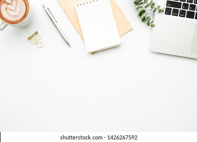 White Minimalist Office Desk Table With Laptop Computer, Cup Of Coffee And Supplies. Top View With Copy Space, Flat Lay.