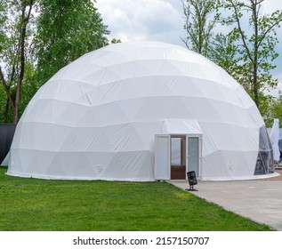 White mobile dome design. Outside spherical glamping dome. Hemispherical structure lattice shell geodesic polyhedron. Camping house hotel party tent. Folk accommodation park outdoor leisure recreation