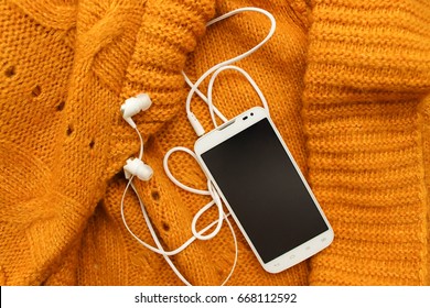 White Mobile Phone With Headphones, Soft Knitted Yellow Plaid