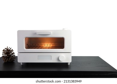 white modern design toaster oven , countertop or convection oven is on the black wooden table with pinecone background of white wall of the kitchen (clipping path included) - Shutterstock ID 2131383949