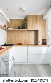 White, Modern Kitchen With Wooden Furniture And Big Window