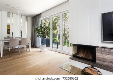 White Modern Living Room Interior With Fire Place And Stairs