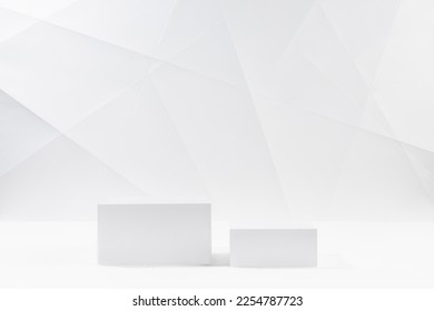 White modern stage with two square podiums in hard light mockup in white interior with lines and angles of graphic geometric minimal style for presentation cosmetic products, goods, branding, design. - Shutterstock ID 2254787723
