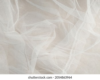 White mosquito net fabric texture with folds. Wavy chiffon background. Full frame of crumpled white cloth material texture. Abstract white net fabric pattern for patterns and designs. - Shutterstock ID 2054863964