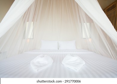 White Mosquito Net Over A Bed In A Luxurious Hotel, Interior