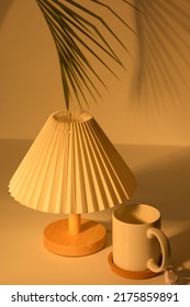 White Mug And Electric Lamp On Natural Warm Light Background.