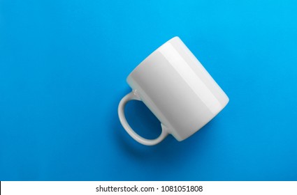White mug mock-up on blue background - Shutterstock ID 1081051808
