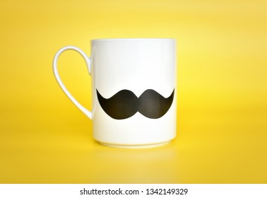 White Mug With Mustache On Yellow Background, Happy Fathers Day, International Mens Day, Boss Day Concept.