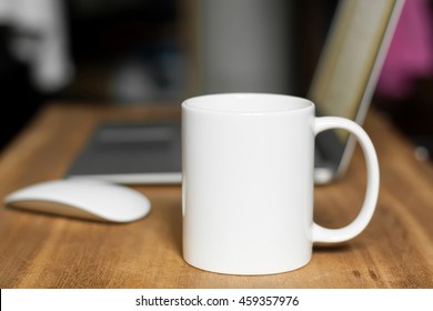 White mug on the desktop - Shutterstock ID 459357976