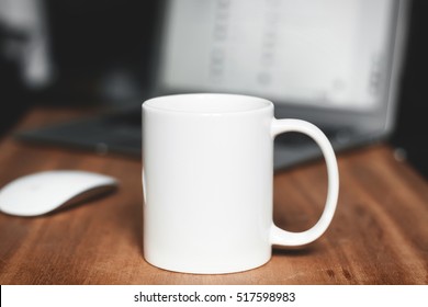 White mug on the desktop - Shutterstock ID 517598983