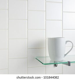 White Mug On Glass Shelf