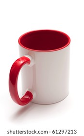 White Mug With Red Handle Isolated On White Background