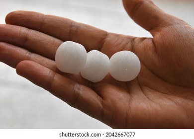 White Naphthalene Balls In Hand