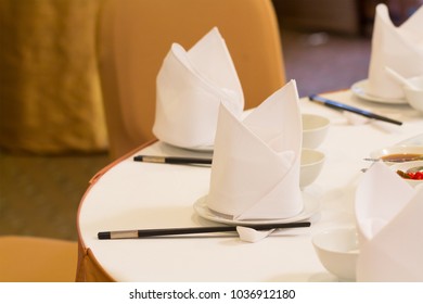 White Napkin And Chinese Table Setting In Chinese Banquet Party.