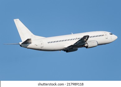 White Narrow Body Boeing Climbing Into The Sky