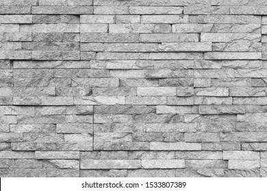 White natural facade stone decoration quartzite background texture. modern granite stone wall.