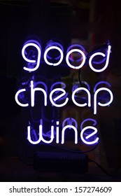 A White Neon Sign Reading Good Cheap Wine