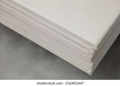 White New Drywall Sheets In Stack Closeup