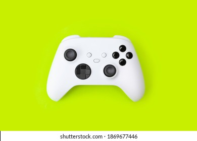 White Next Gen Game Controller On Green Background.