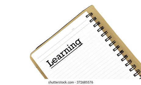 White note book with text LEARNING isolated on white background