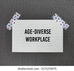 White Note Paper Stick On Office Wall With Words AGE-DIVERSE WORKPLACE, Refers To Multi-generational Workforce And Age Diversity In Environment In Office Or Organization