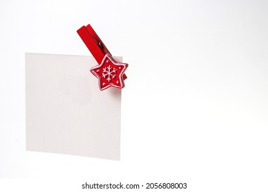 White Note With A Red Christmas Clothespin Copy Space