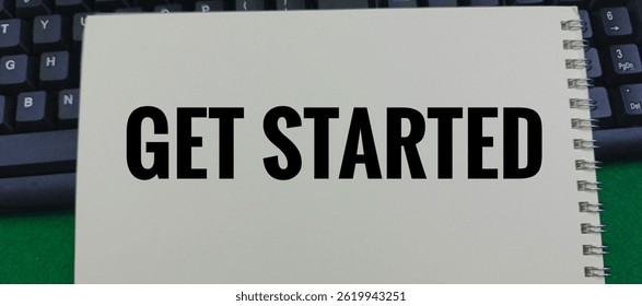 White Notebook with 'Get Started' Text Placed on Keyboard – Motivation, Online Registration, Startup Concept, Call to Action, Business or Education Background. 