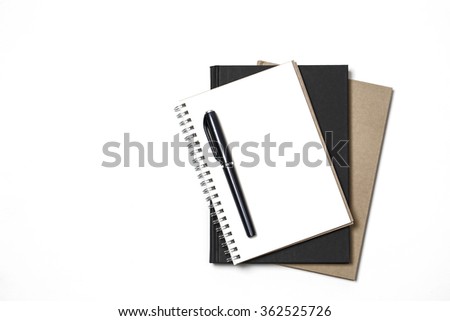 White notebook paper brown and black with black pen on white background