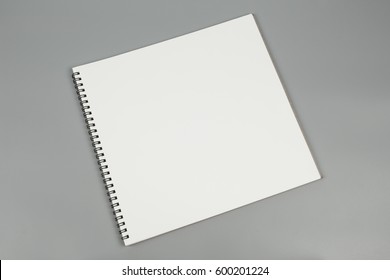 white notebook paper on gray background, blank paper for text message or artwork