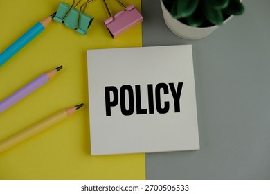 white notebook with the word policy. basic concepts or organizational policies