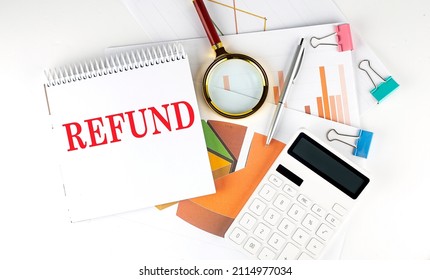 White notepad text REFUND with diagram,chart,calculator on white background - Shutterstock ID 2114977034