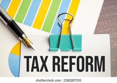 White Notepad Text TAX REFORM With Diagram And Pen