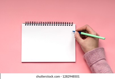 White Notepad for writing on pink background. - Shutterstock ID 1282948501