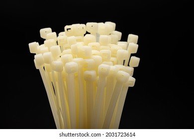 White Nylon Cable Tie Or Zip Tie On Black Background