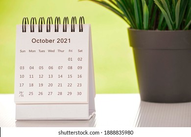 White October 2021 calendar with green backgrounds and potted plant. 2021 New Year Concept - Shutterstock ID 1888835980